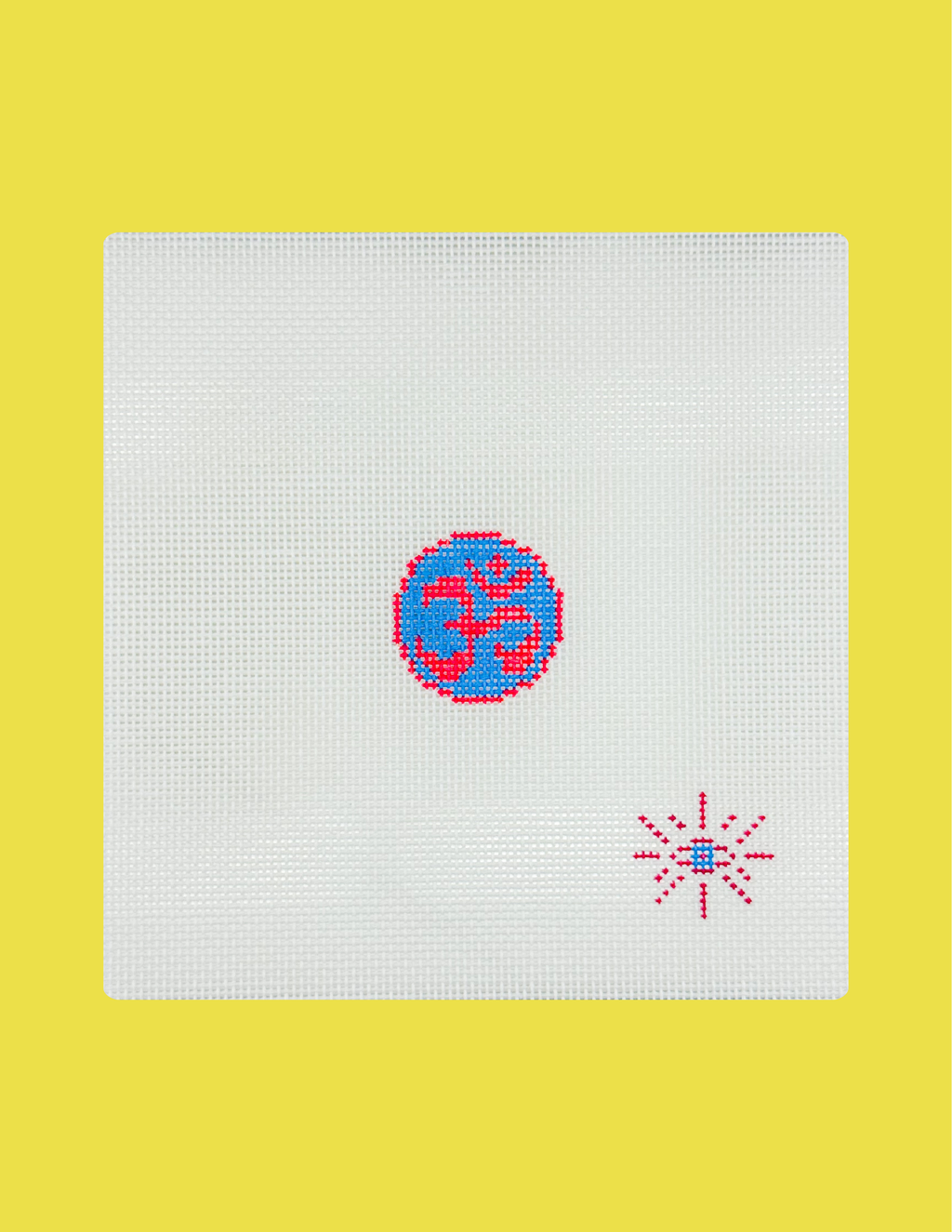 A square white needlepoint canvas featuring a blue and red Om symbol in the center and a red dotted starburst in the lower right, set against a solid yellow background.